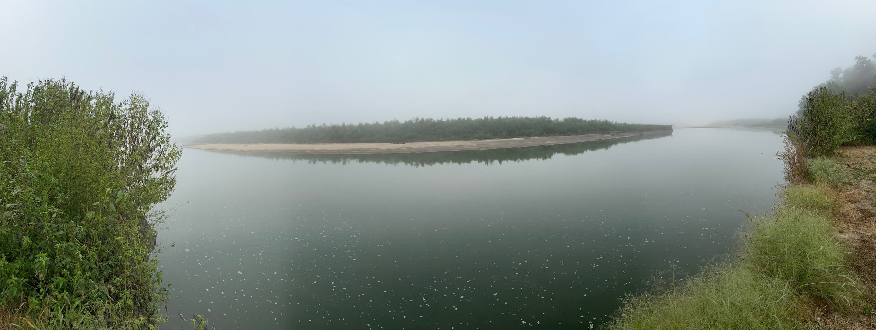 Foggy river panorama with sandbar
